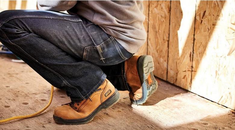 Ariat work boots flexing on a job site